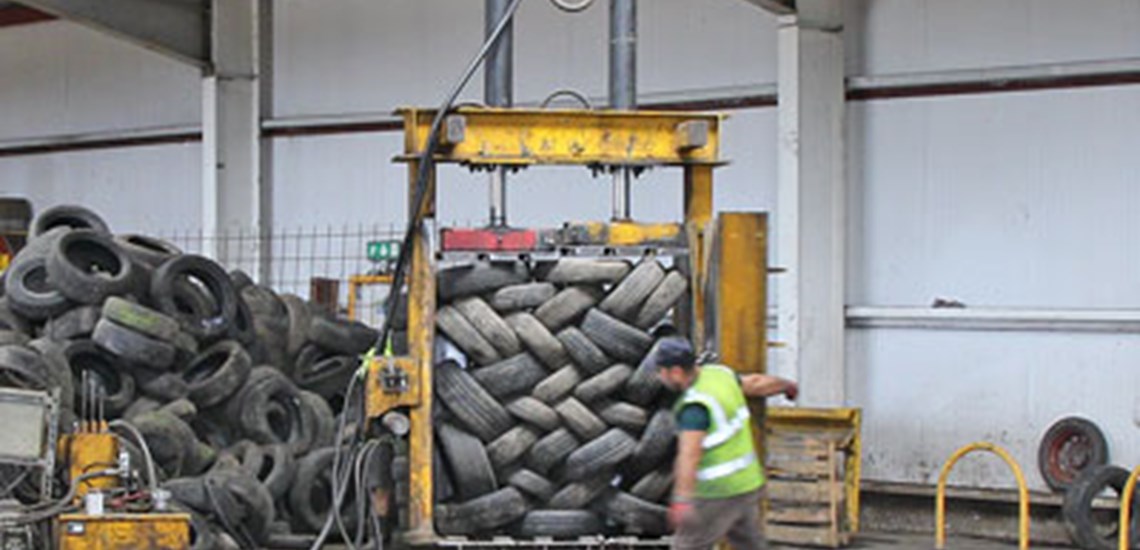 Waste Tyres being baled for export to India